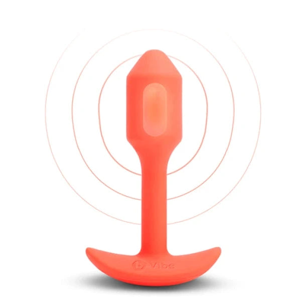 Orange silicone butt plug on a white background