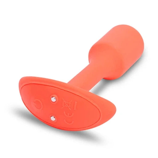 Orange silicone butt plug on a white background