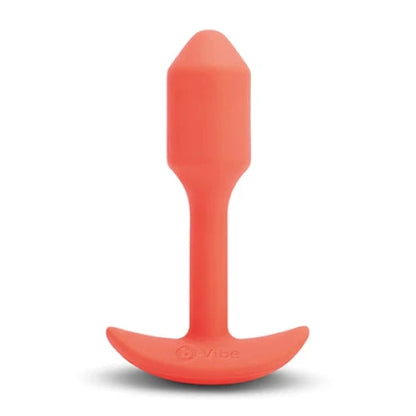 Orange silicone butt plug on a white background