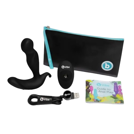 B-Vibe product set with black device, remote, USB cable, and guide on a white background