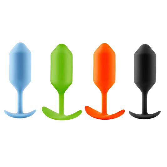 Four colorful silicone butt plugs on a white background