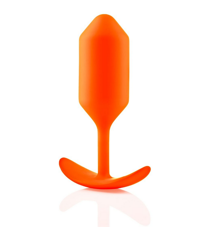 Orange silicone butt plug on a white background