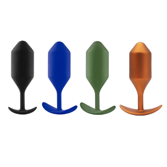 Four colorful silicone butt plugs on a white background