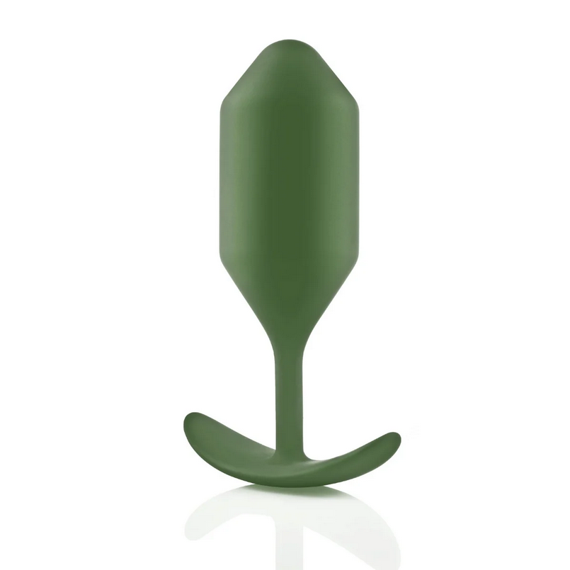 Green silicone butt plug on a white background