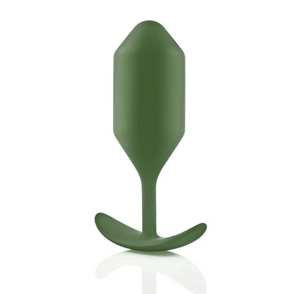 Green silicone butt plug on a white background