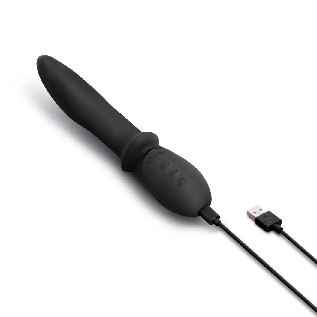 Black electronic device with USB cable on a white background
