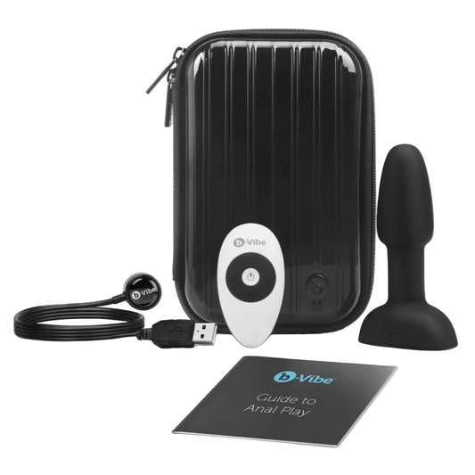 anal plug vibrator product set with black case, remote control, USB cable, and manual on a white background