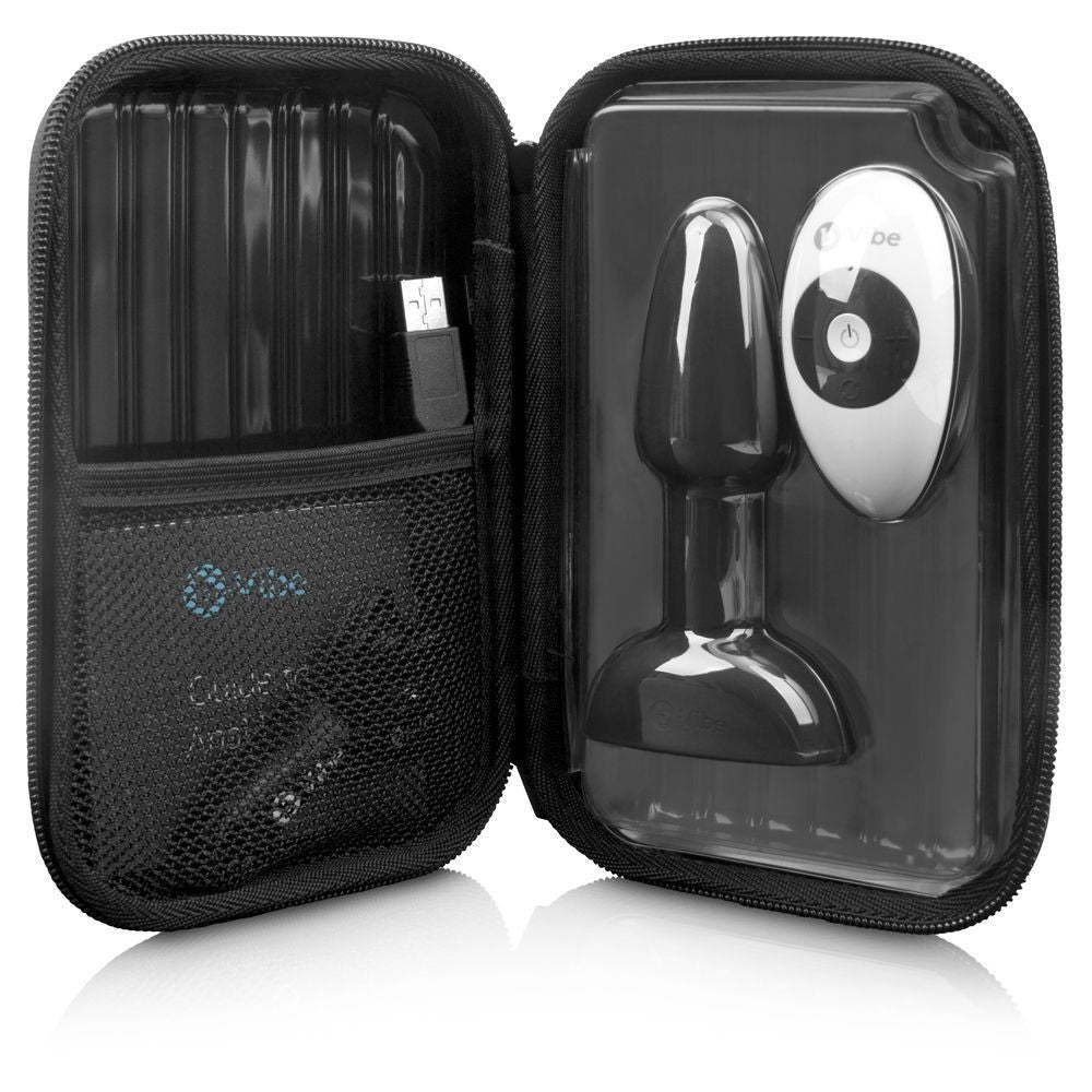 Black travel case with electronic device and accessories on a white background