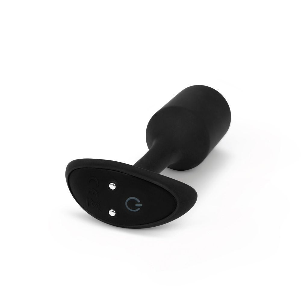 Black silicone butt plug on a white background