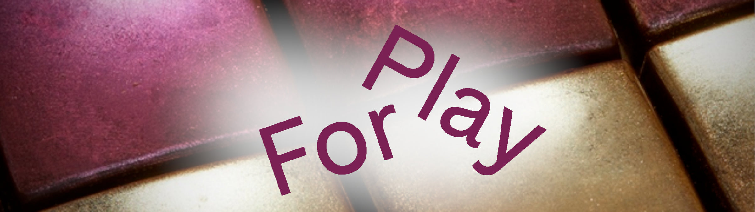 Close-up of a chocolates with 'For Play' text overlay
