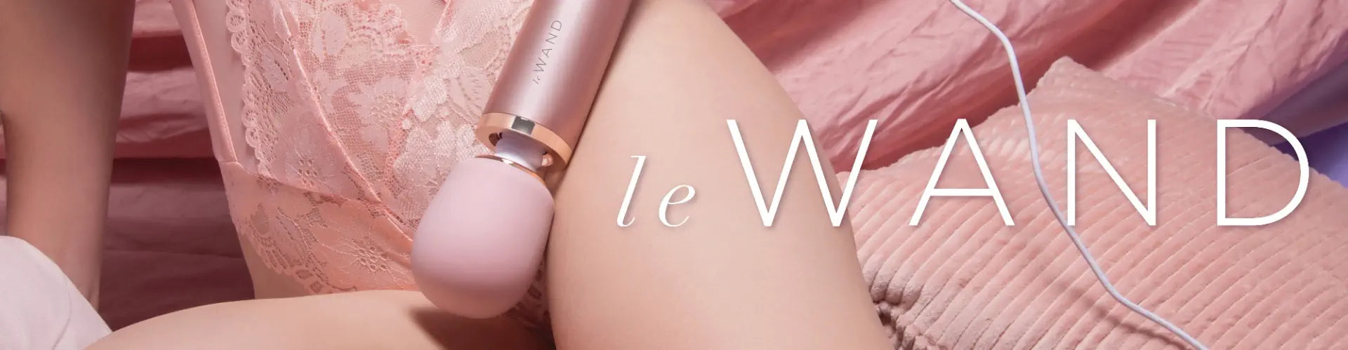 woman holding massage wand vibrator with le wand logo overlayed