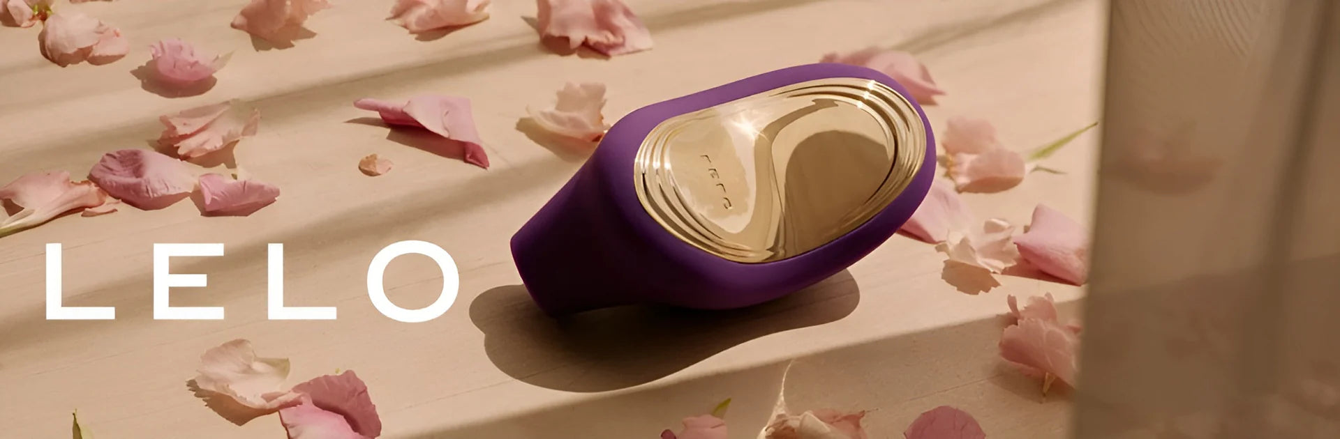 LELO product on a surface with pink petals
