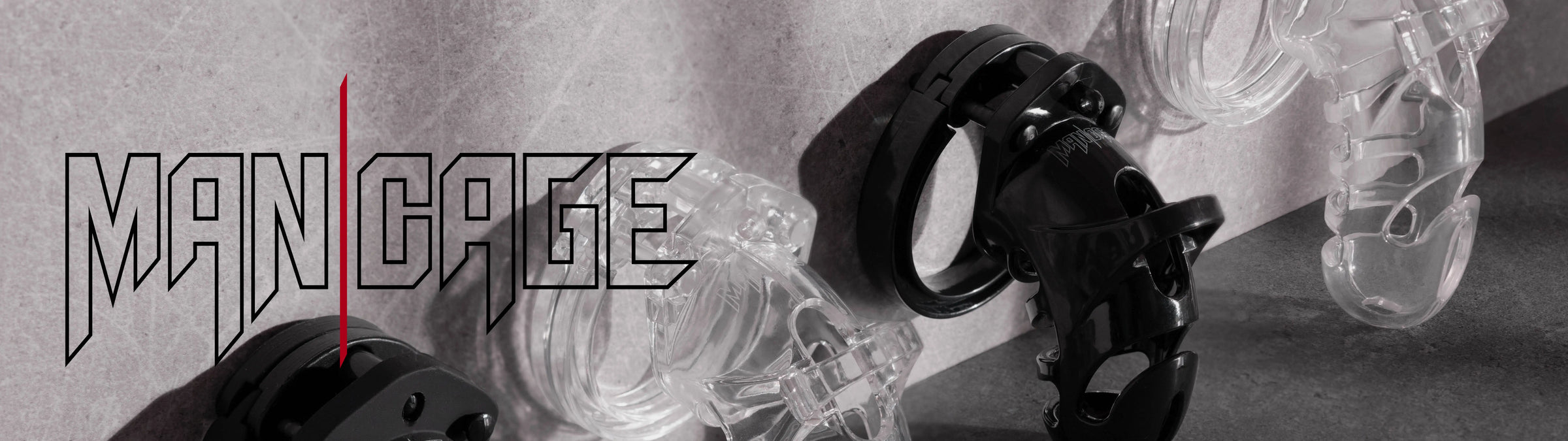 Black and white image of chastiry penis cages with 'Man Cage' branding.