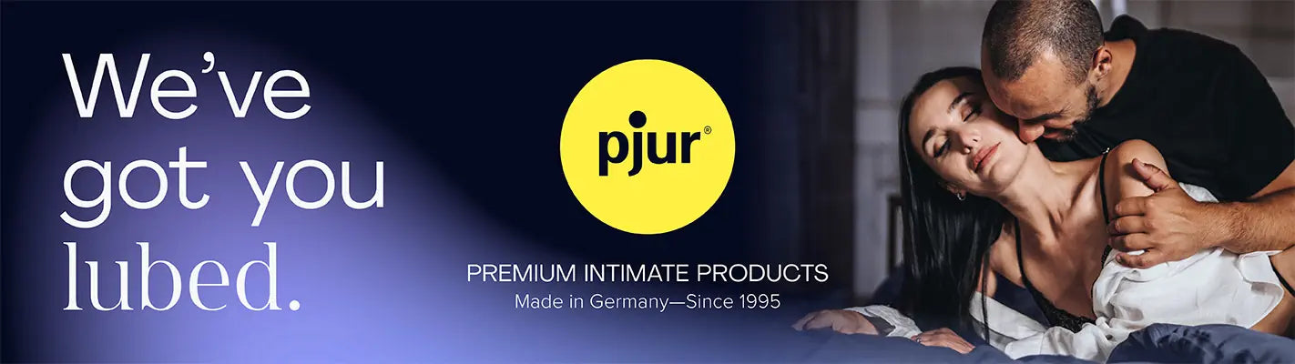 Advertisement for pjur with a couple embracing, featuring the brand logo and text 'We've got you lubed.'